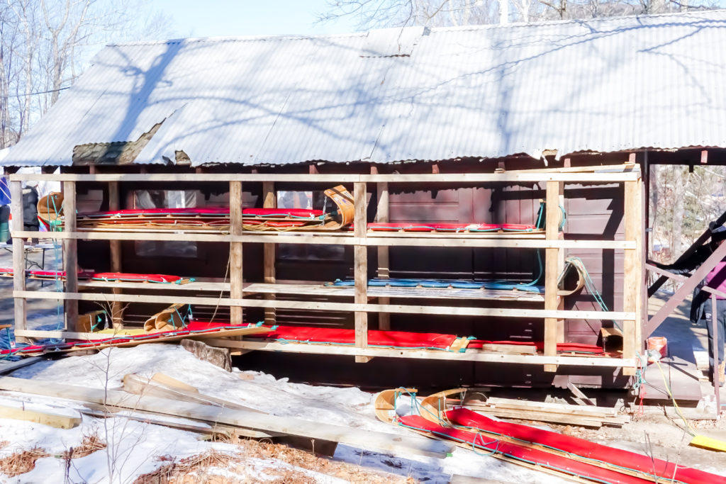 a slew of toboggans waiting to be used