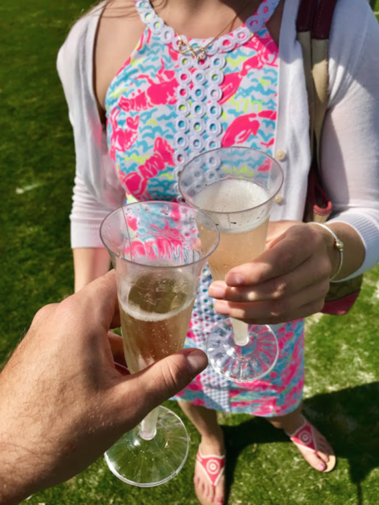 clinking champagne glasses during half time 