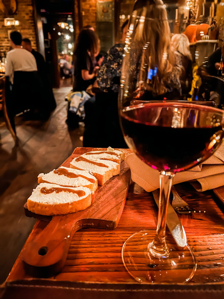 Nero D'Avola wine and ricotta bruschette for appetizers at UVA. Wine and cheese, the perfect pairing for 24 hours in New York City. 